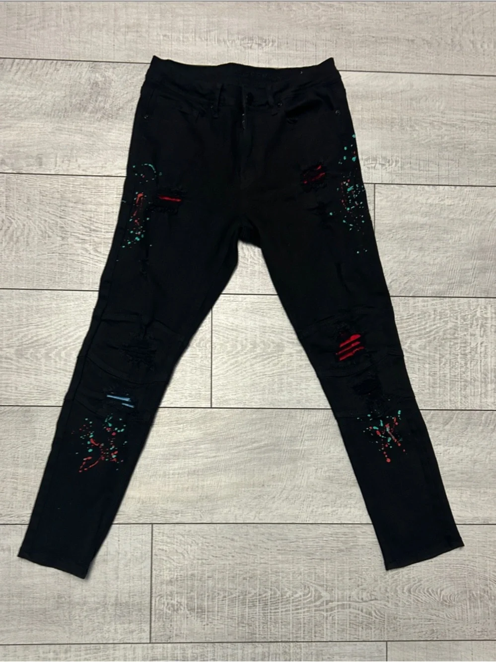 Rue21 Black Distressed Jeans with Red and Teal Paint Splatter